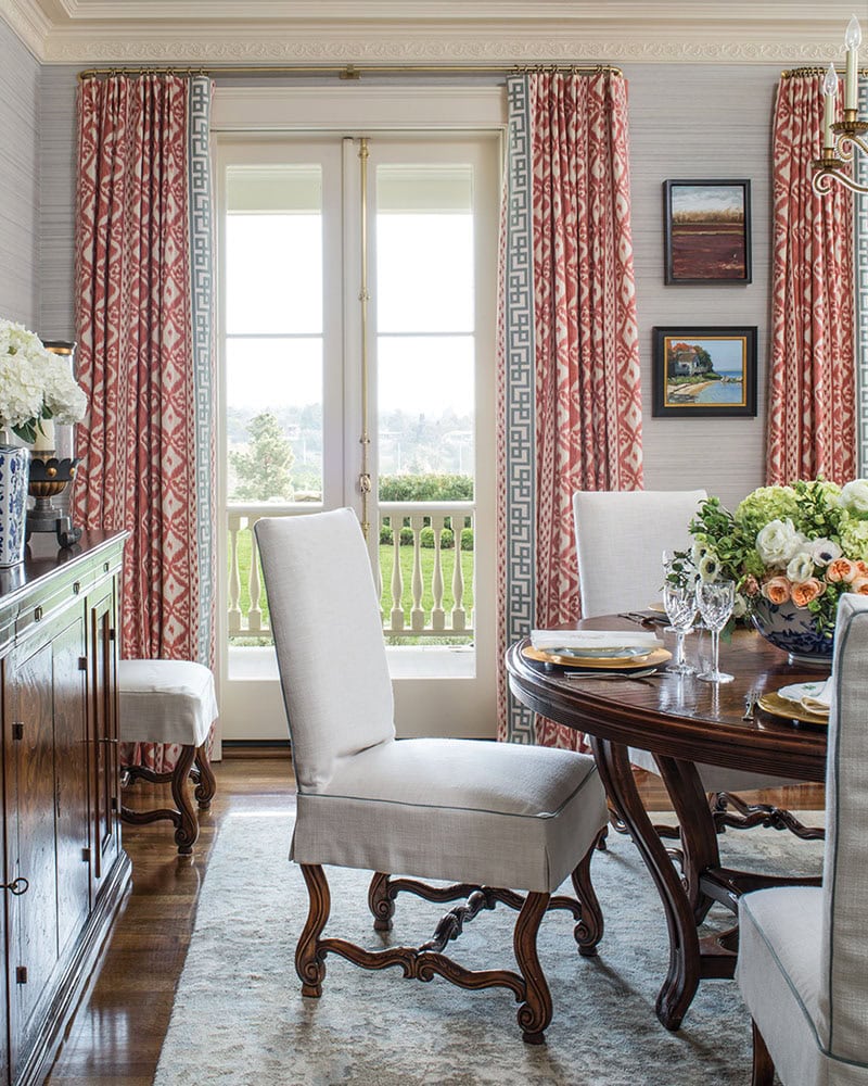 Classic dining room with colorful patterned drapes