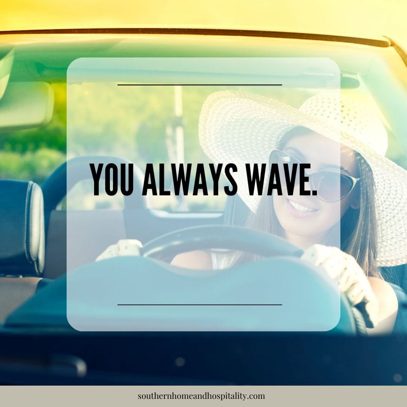 Woman driving a car with text overlay about waving when someone lets you into traffic