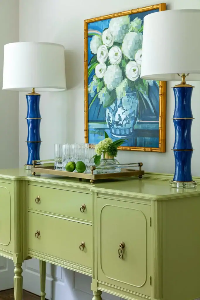 Fresh green vintage sideboard with blue lamps