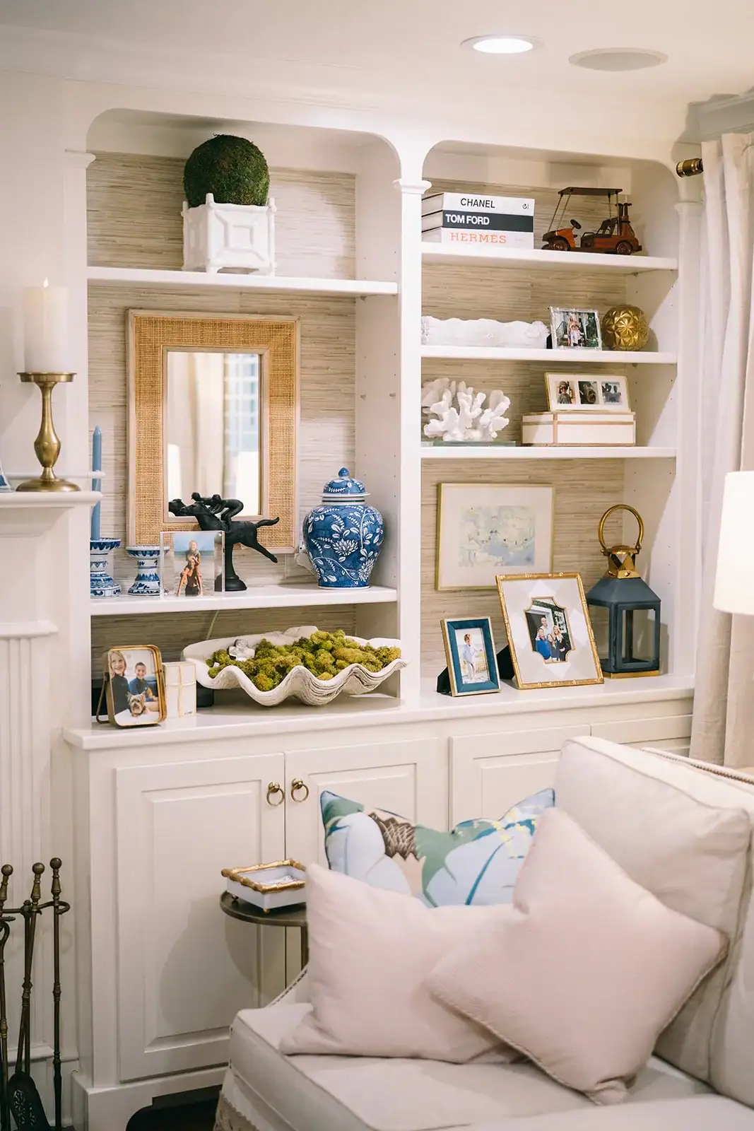 Built ins with grasscloth wallpaper