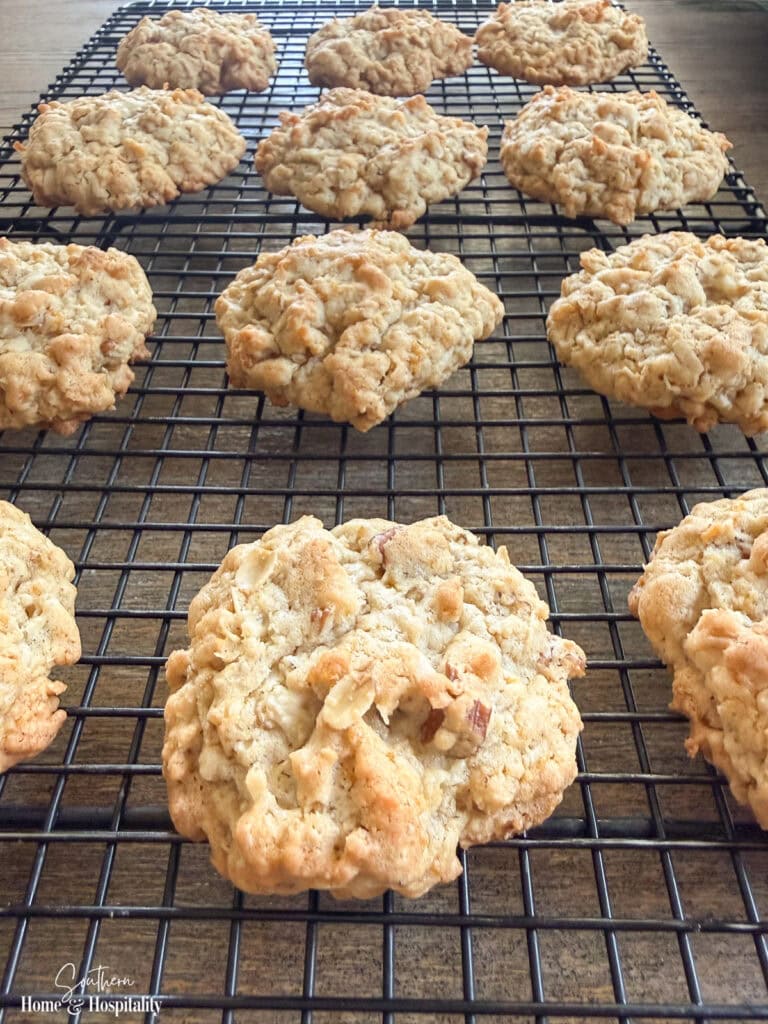 Freshly baked Old-Fashioned Ranger Cookies cooling on a wire rack.