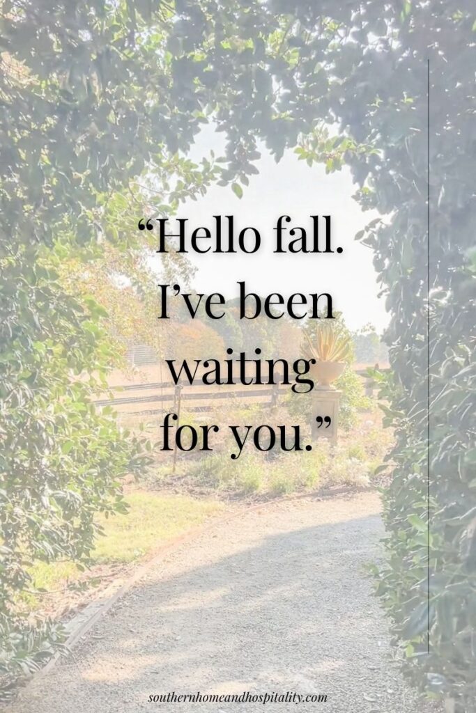 Sunlit garden path surrounded by greenery with the saying “Hello fall. I’ve been waiting for you.”