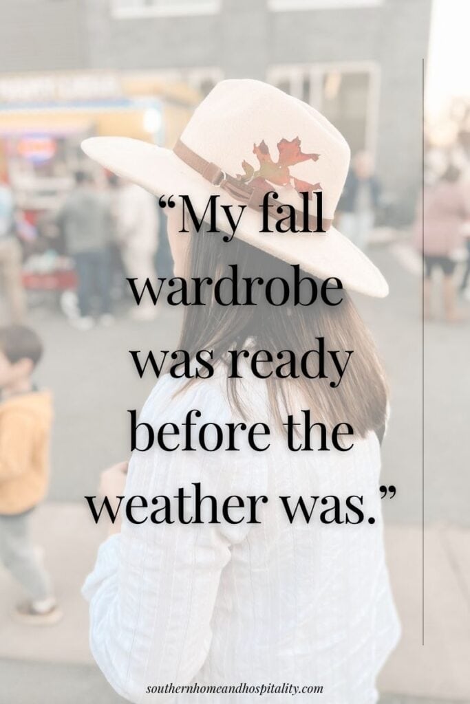 Woman wearing a light-colored hat accented with a fall leaf with the funny saying “My fall wardrobe was ready before the weather was.”