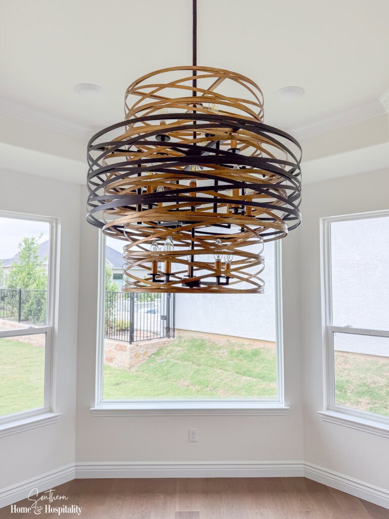 Decorative woven light fixture installed in a new home