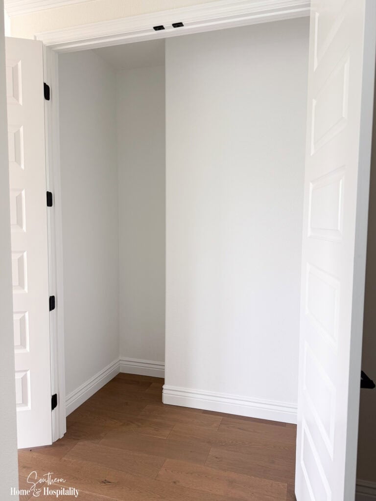 Original linen closet before conversion into clothes closet