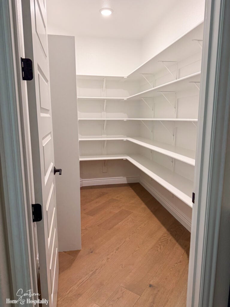 Walk-in pantry with shelving designed for everyday kitchen storage