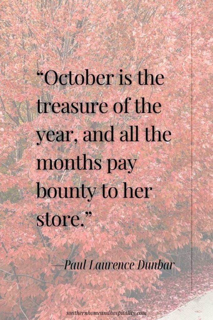 Brilliant red autumn tree with the Paul Laurence Dunbar quote “October is the treasure of the year, and all the months pay bounty to her store.”