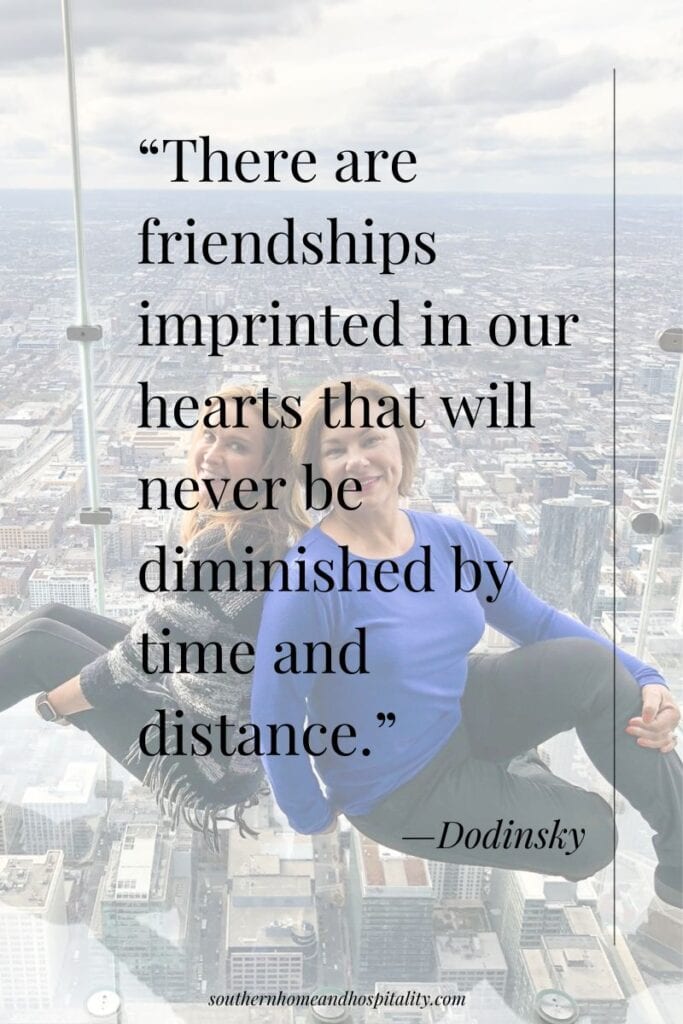 Two friends overlooking the city with quote about friendship never being diminished by time and distance