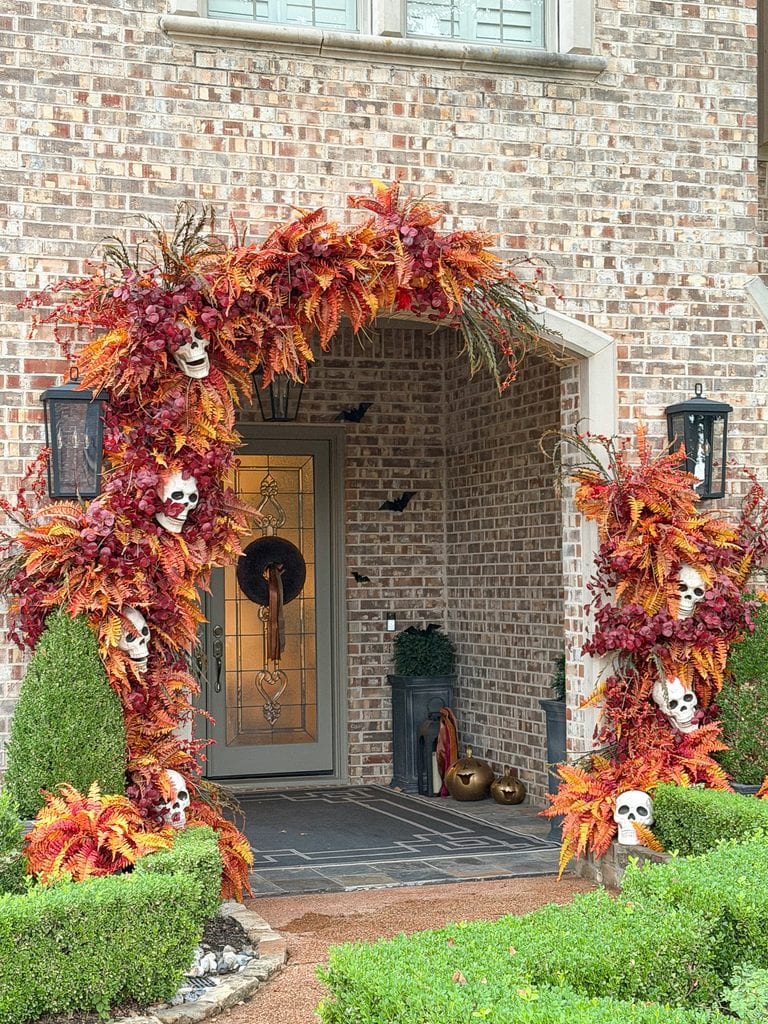 Beautiful Halloween garland with faux fall ferns, branches, and skulls